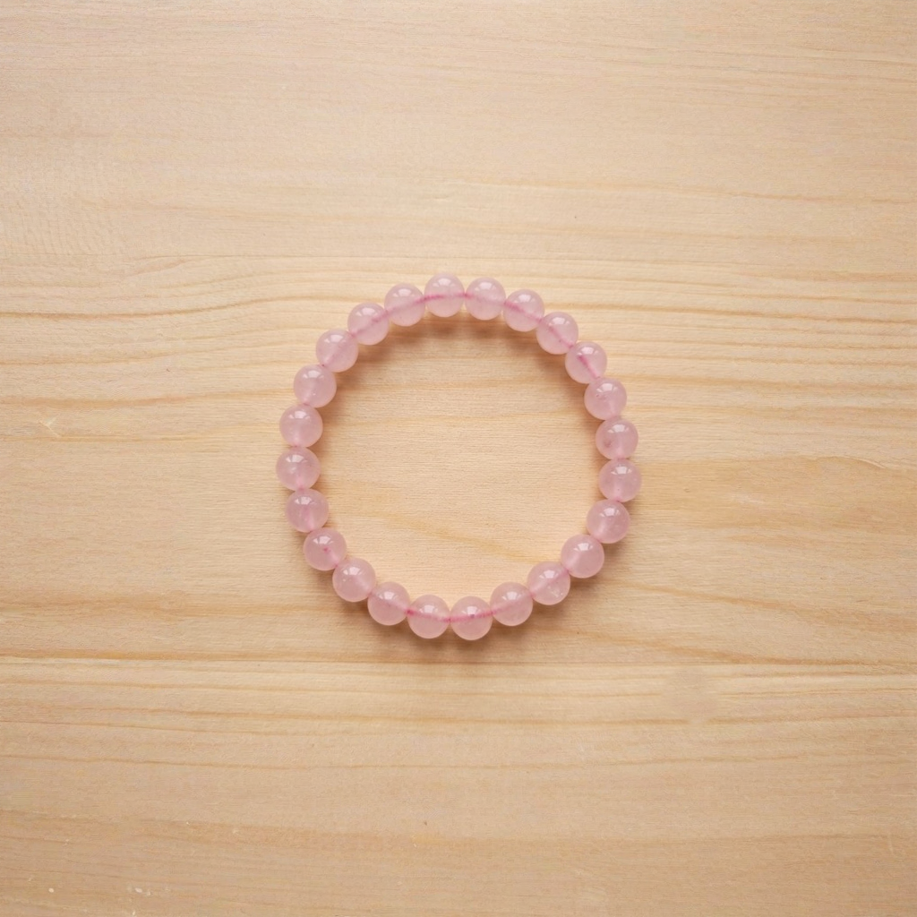 Rose Quartz Bracelet Close Up Showing Smooth Pink Beads