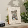 Handcrafted mother of pearl photo frame with geometric shell inlay pattern for luxury home décor