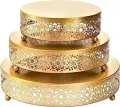 Decorative gold metal round cake stand set with ornate floral cutwork for wedding dessert display