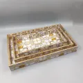 Decorative gold mirrored serving tray set with geometric pattern for luxury home décor.