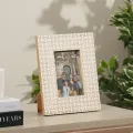 Handcrafted mother of pearl photo frame with geometric shell inlay pattern for luxury home décor