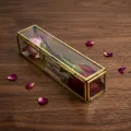Luxury glass rose box with golden metal frame for elegant home decor and flower display