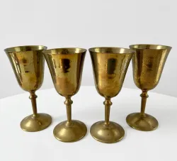 Handcrafted solid brass goblets with polished finish displayed as premium wholesale brass drinkware for hospitality, gifting, and international export markets.