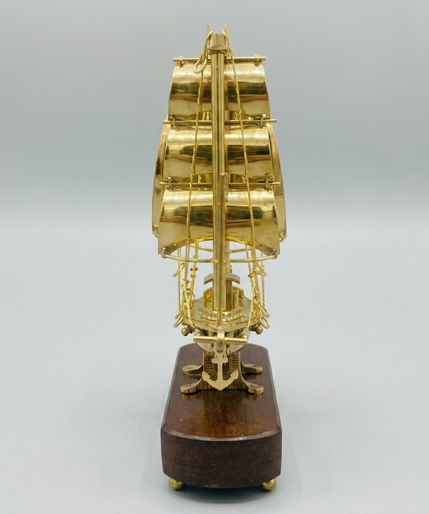 Handmade vintage brass sailing ship model with wooden base for luxury home and office decor